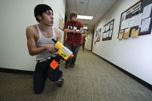 UNF students participatin in the Nerf Wars "slice the pie" to clear out a hallway